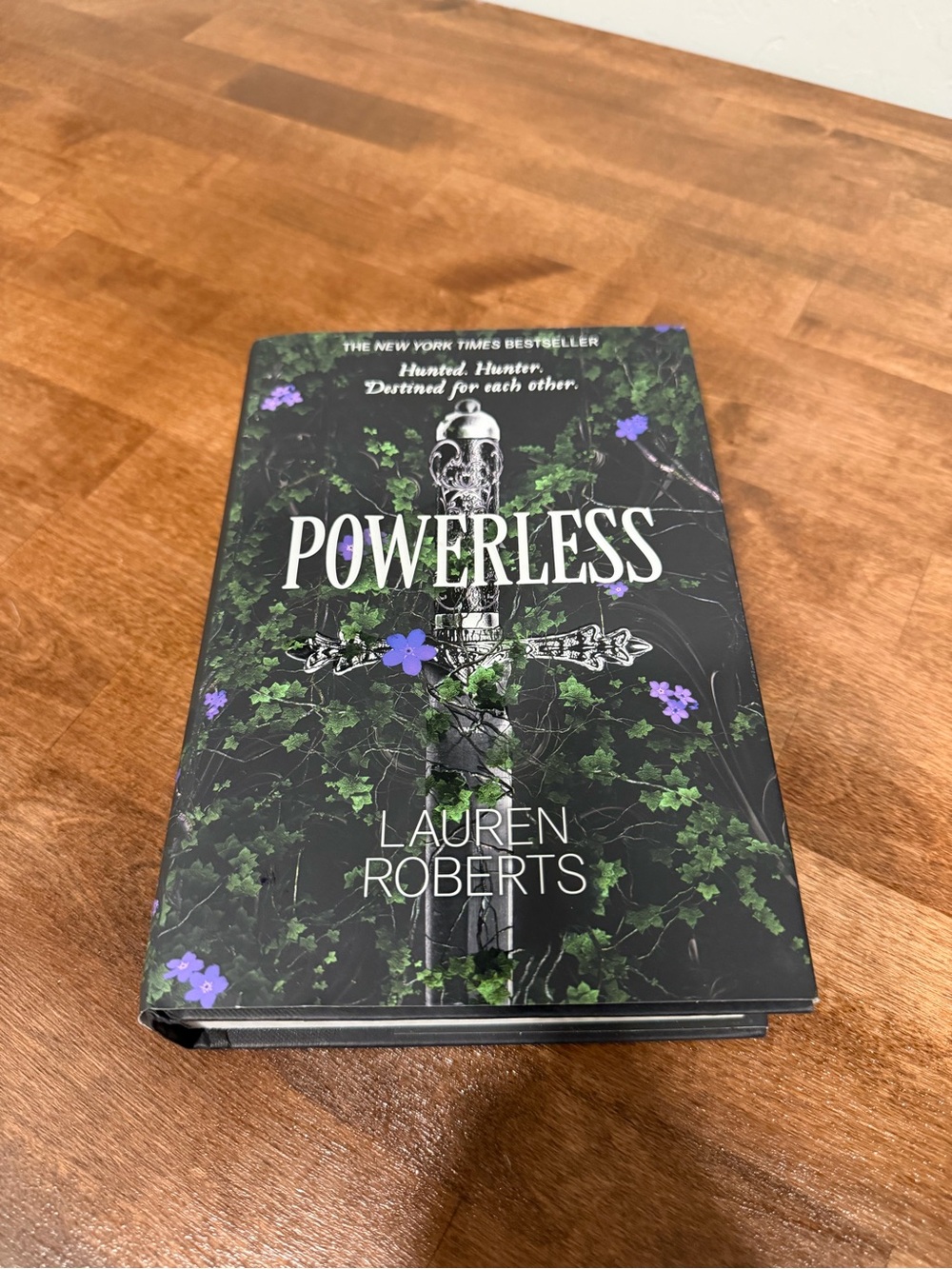 Powerless by Lauren Roberts - Hardcover Book, Black & Green Cover
